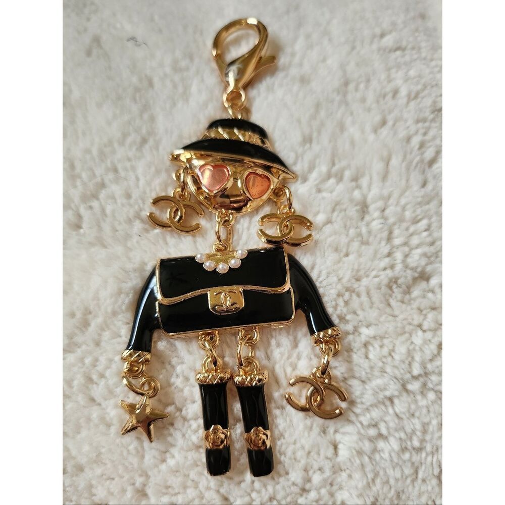 CHANEL Black and Gold Enamel Charm Doll with Pink Heart Sunglasses